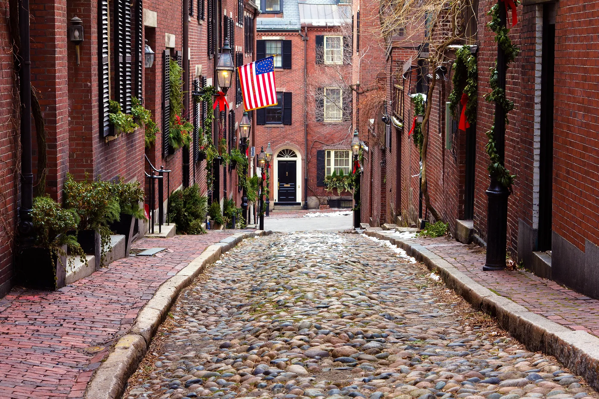 Brick townhouses on a cobbled Beacon Hill street in Boston